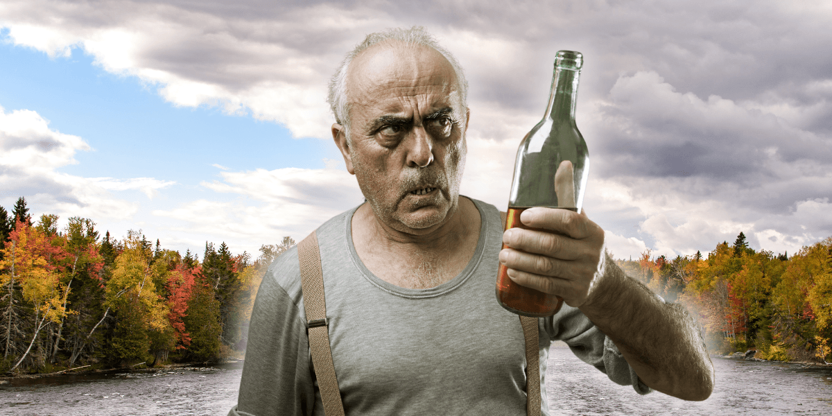Man med alkohol, inklippt vid en sjö.